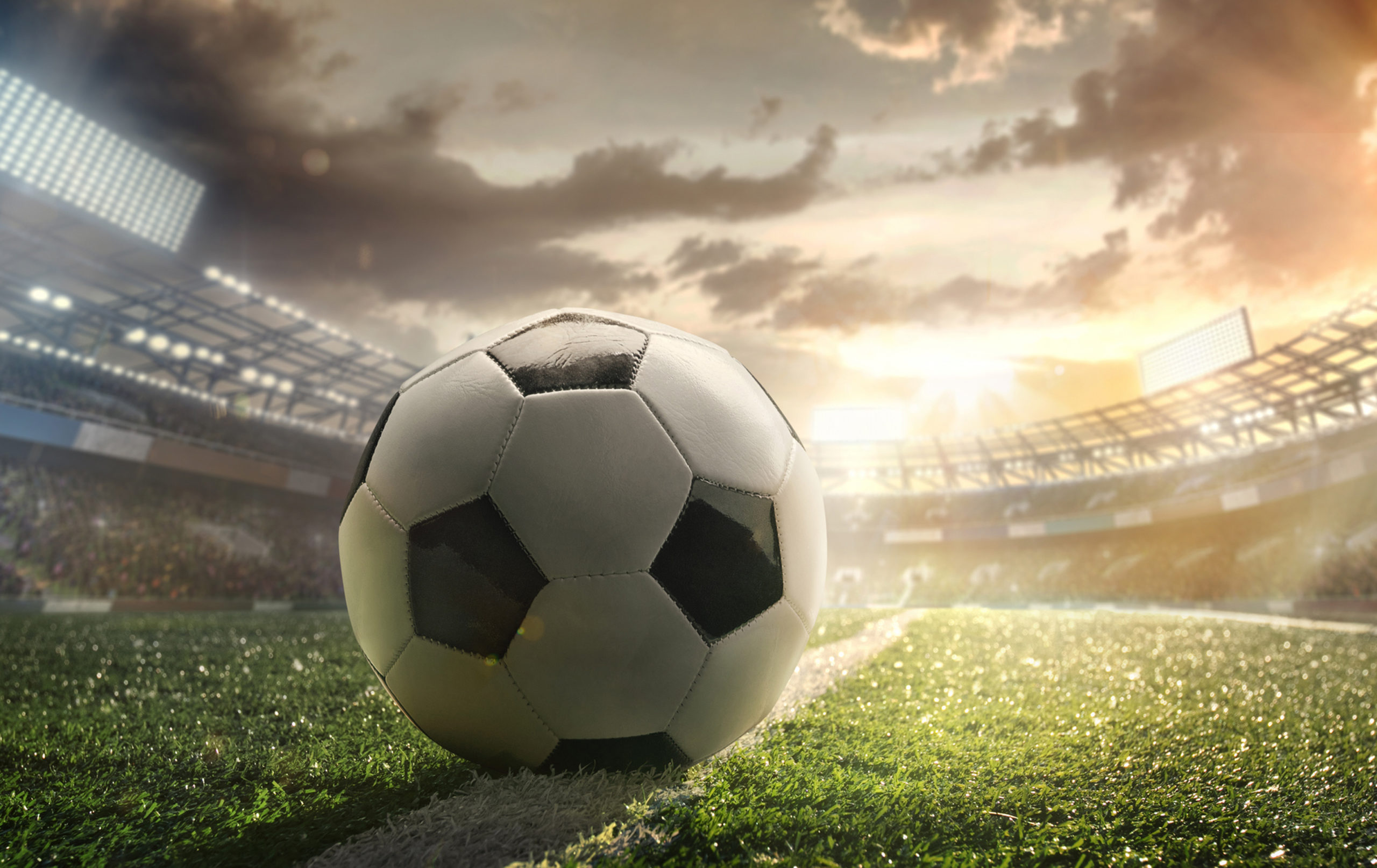 Sport. Empty football soccer field with white marks, green grass texture and soccer ball. Boys-Soccer-scaled